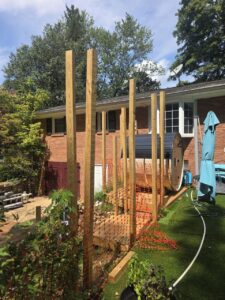 Slatted wood fence with privacy gate